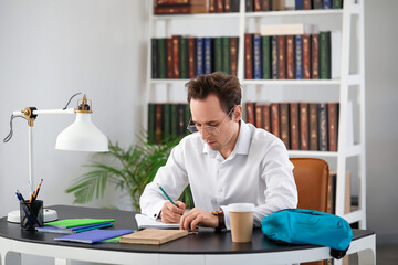 Male student doing lessons at home