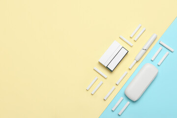 Composition with modern electronic cigar and sticks on colorful background