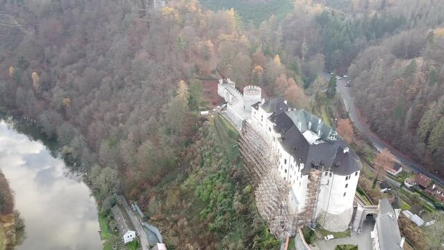 Aerial of the medieval Cesky Sternberk Castle in the Czech Republic surrounded by the forest