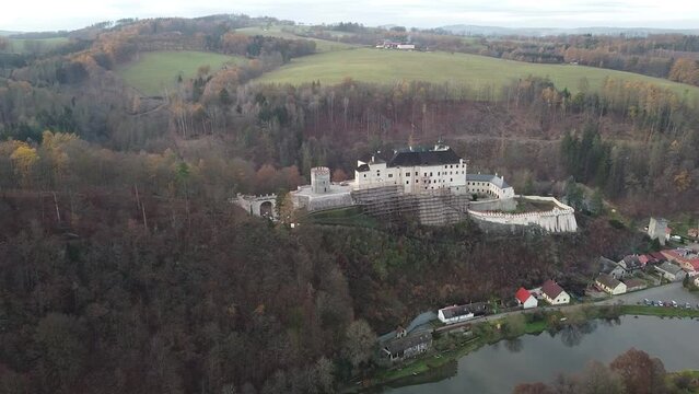 Aerial of the medieval Cesky Sternberk Castle in the Czech Republic surrounded by the forest