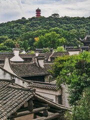 Ancient town in Wuxi City with a pagoda on the mountain in the background in Jiangsu, China