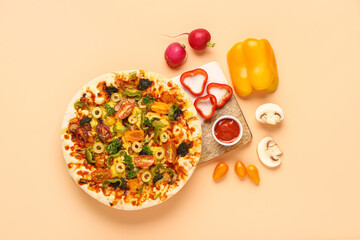 Board with vegetable pizza and ingredients on beige background