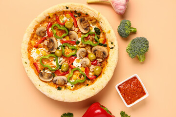 Vegetable pizza with ingredients and sauce on beige background