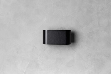 black wall lamp on gray wall copy space
