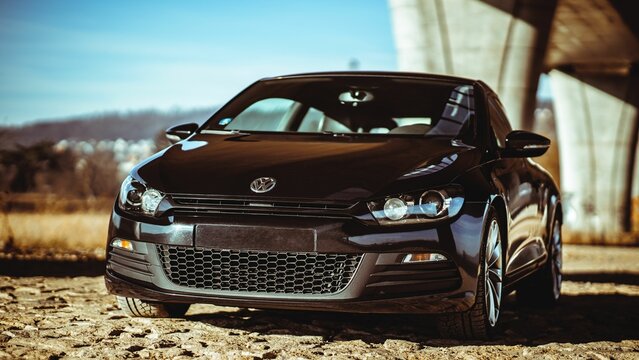 Front view of a black Volkswagen Scirocco under the highway bridge, Prague, Czech Republic