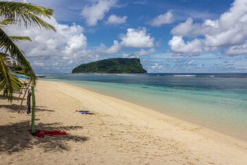 Paradise tropical beach Lalomanu on Upolu island, Samoa in the Pacific Ocean with bright turquoise water, golden sand, overlooking the island of Nuutele. Summer, sun, great vacation and travel.