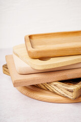 Different wooden cutting boards on white background