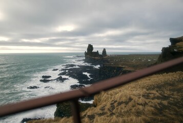 The rough west coast of Iceland with huge waves, rocks and a lot of depth of field