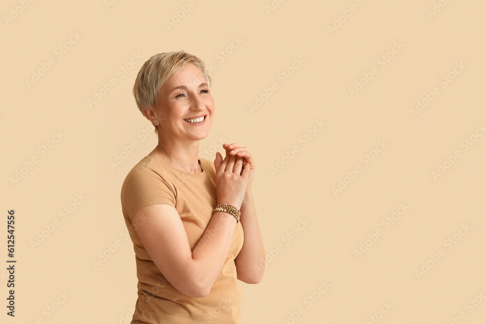 Poster mature blonde woman on beige background