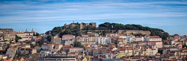 Fototapeta na wymiar Panoramic shot of residential buildings of Lisbon with the Saint George's Castle on the background