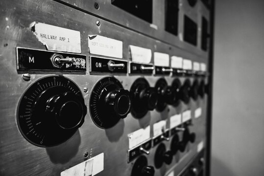 Closeup of switches and knobs on an antique control panel