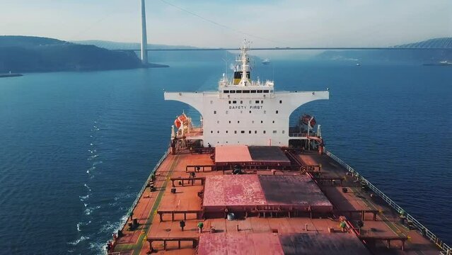 Topmost of a bulk carrier underway. Communication equipments, VDR capsule, AIS antennas, radar scanner attached to mast. Funnel, chimney or smokestack on a ship utilized for expelling smoke. Bosphorus