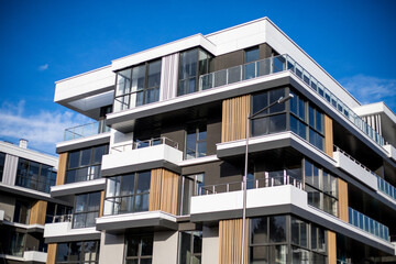 New apartment building on a sunny day. Modern residential architecture. The apartment is waiting for new residents