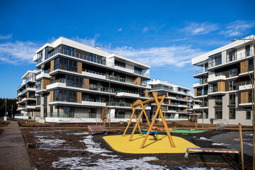 Fototapeta na wymiar architectural complex of residential buildings and outdoor facilities in early spring