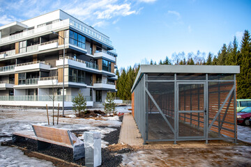 Fototapeta na wymiar new stylish luxury apartment building and covered bike parking in the yard