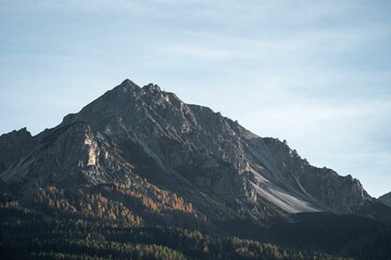 Beautiful view of the rocky mountain peak and forest.