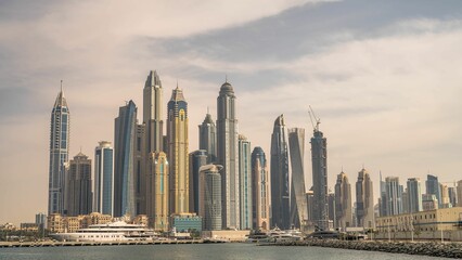 Obraz na płótnie Canvas Clouds over the modern glass skyscrapers in Dubai