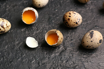 Fresh quail eggs on dark background