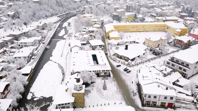 Aerial view of Tryavna buildings covered in snow, Bulgaria