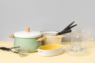 Fototapeta na wymiar Set of different kitchen utensils on color background