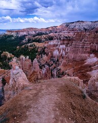 Vertcal shot of rocky heights at Bryce Canyon National Park and green trees in Utah, USA