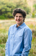 teen boy with brown hair and braces