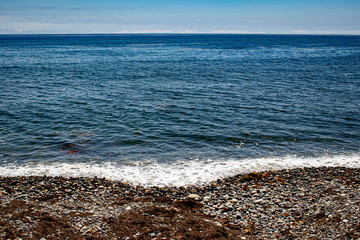 Beautiful Dark Blue Waters of the Pacific Ocean Contrast against a Rocky Shoreline in La Jolla, California, USA