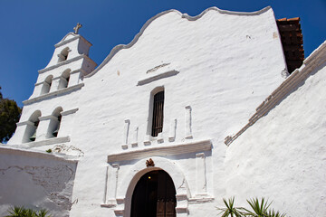 White Adobe Contrasts with Dark Brown Wood on the Façade of Mission Basilica San Diego de Alcala in San Diego, California, USA