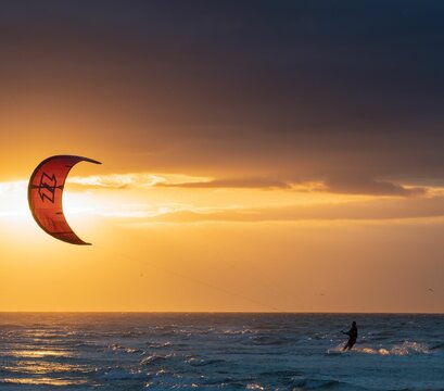 Kite surfer on the North Sea during the sunset