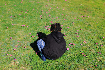 black African boy picking flowers