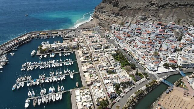 Aerial view of Puerto de Mogan harbor with ships in Gran Canaria, Spain