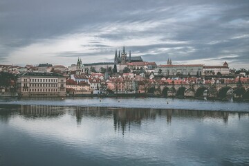 Fototapeta na wymiar The cityscape of Prague, Czech Republic, on a cloudy winter day, with the Vltava River coast
