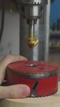 Vertical of a countersink being prepared to cut a conical hole into a metal object