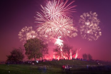 Fototapeta na wymiar Beautiful shot of exploding colorful fireworks in a night sky over Heaton Park