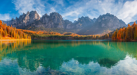 beautiful fairytale landscape in a perfect sunset panorama of a lake