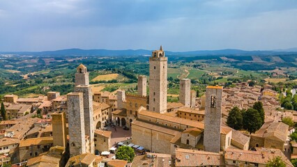 Obraz premium Aerial view of the San Gimignano Torre Grossa with a blue sky in the background, Italy, Tuscany