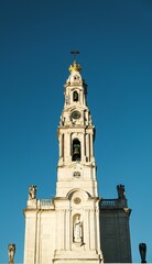 Sanctuary of Our Lady of Fatima in Portugal against a blue sky