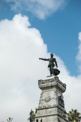 Fototapeta premium Vertical shot of the statue on the top of the building in Portugal, Porto