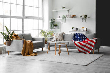 Interior of living room with sofas and USA flag