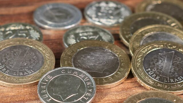 Turkish TL coins. Camera motion over distributed coin money. Inflation jumps to 19-year high in end of last year amid lira swoon. Close up panning video Perfect for financial commerce treasury or bank