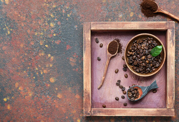 Bowl with coffee beans on grunge background