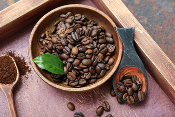Bowl with coffee beans on table