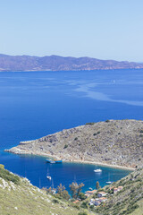 Naklejka na ściany i meble Top view of a small beach in Hydra a Greek island 