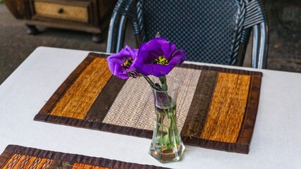 Close-up shot of purple prairie gentian flowers in a vase on a table