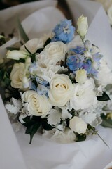 Vertical shot of a bouquet of flowers on the white background