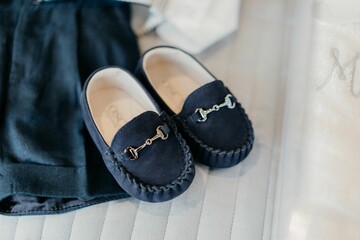 Closeup shot of black shoes on the white background