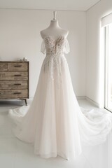 Fototapeta na wymiar Vertical shot of a beautiful long wedding dress on a mannequin