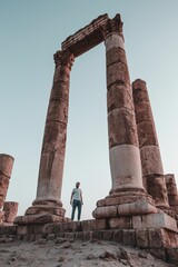 Low angle shot of a man standing at the temple of Hercules in Amman, Jordan