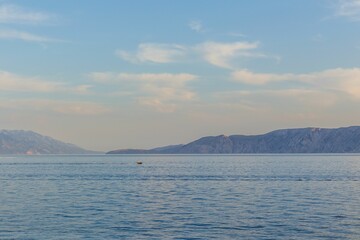 Scenic view of mountains on the other side of the coast of a lake