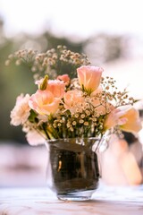 Vertical closeup of a beautiful bouquet in a vase for wedding